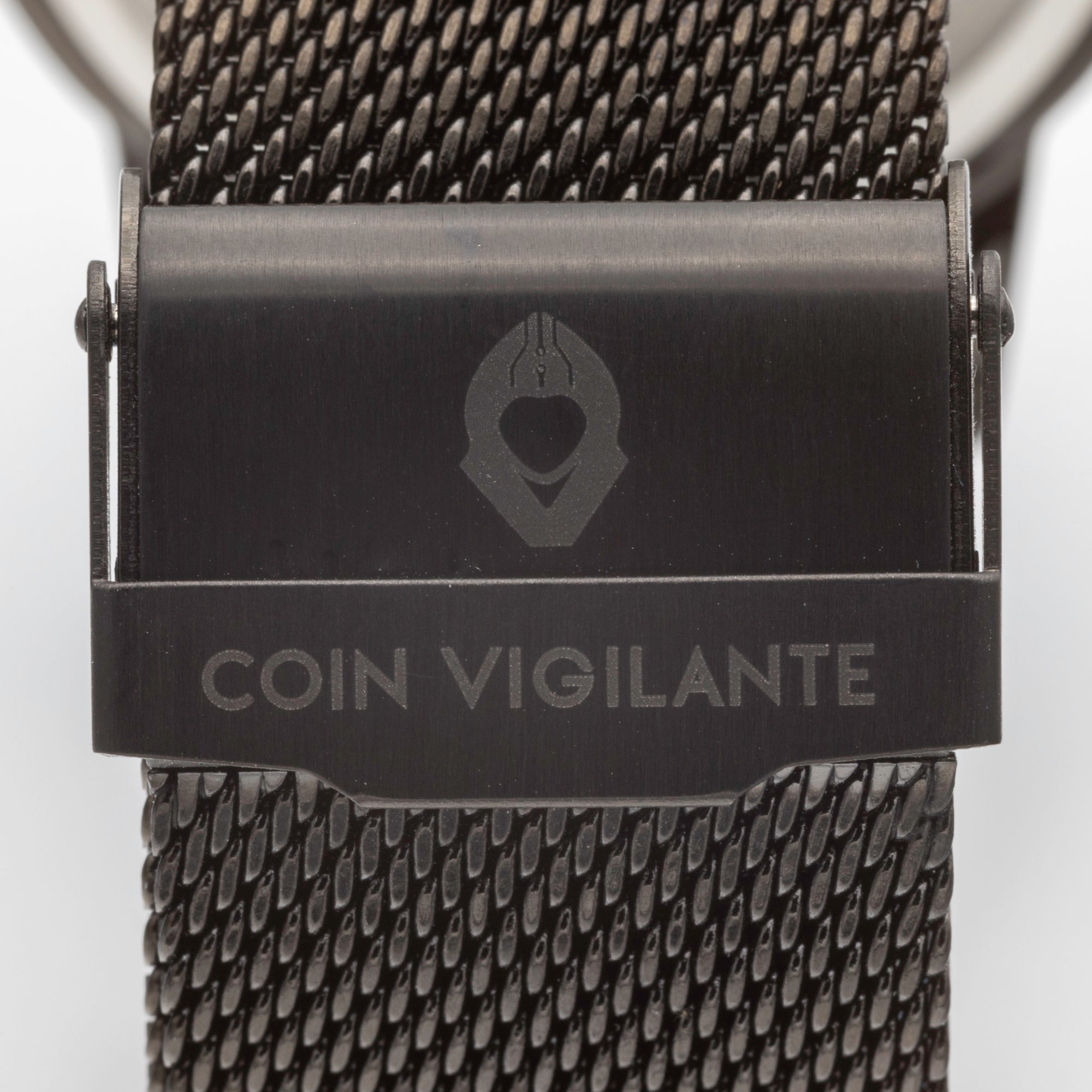 Close-up of Coin Vigilante logo engraved on foldover clasp