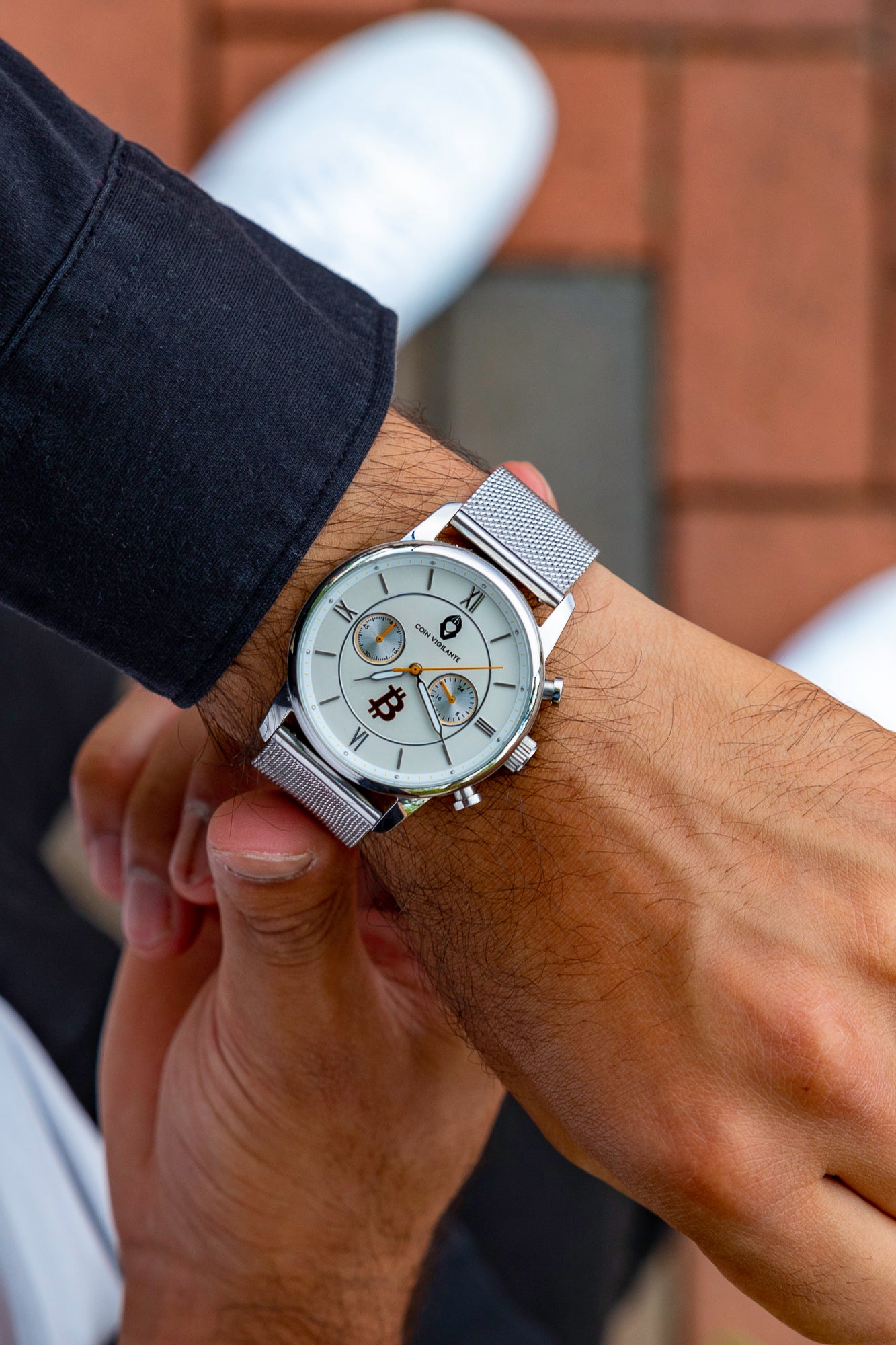 Coin Vigilante Silver Stainless Steel Mesh Band displayed on man's wrist