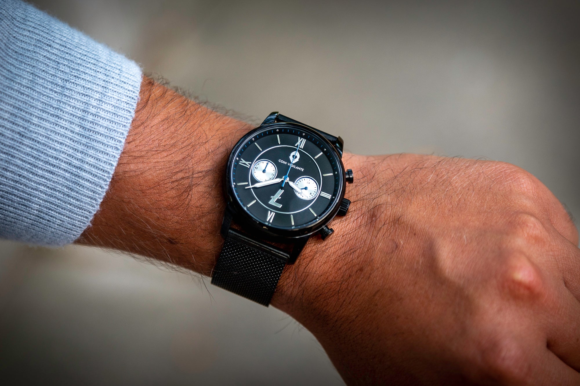 Coin Vigilante Stainless Steel Mesh Band on wrist on Litecoin watch