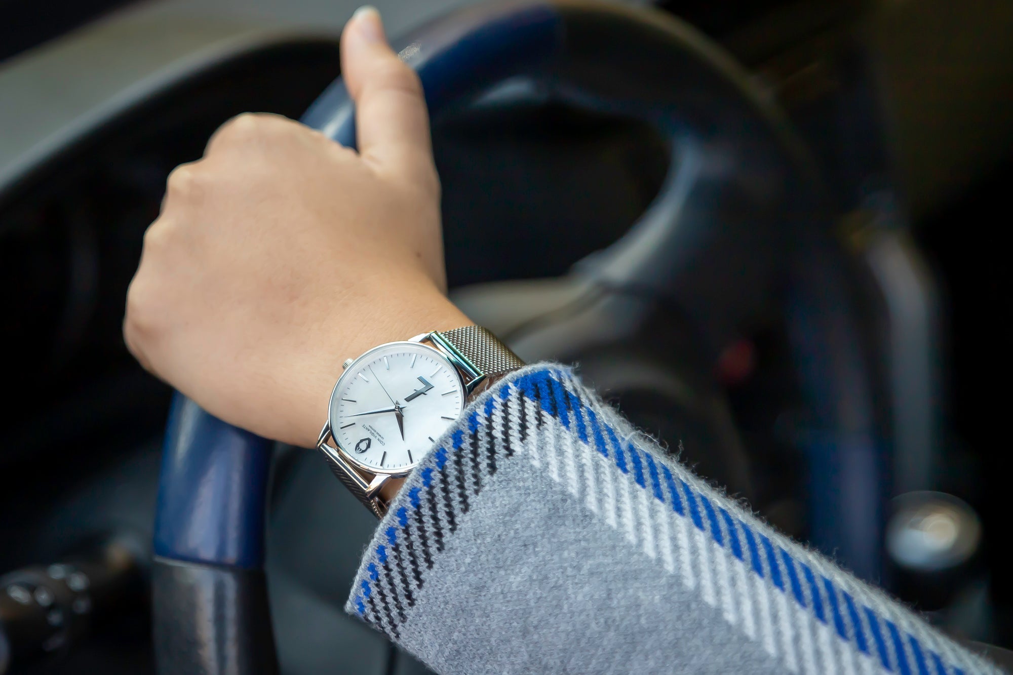Coin Vigilante Genesis Silver Litecoin Watch on lady's wrist driving a car